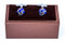 cobalt blue knot cufflinks displayed on presentation gift box close up image