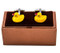 rubber ducky cufflinks displayed on presentation gift box