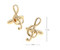 Gold treble clef cufflinks shown as a pair with size dimensions 9 mm by 11 mm close up image