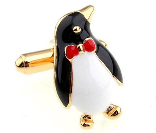 Gold Emperor Penguins ina red bowtie cufflinks close up image
