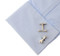 lock wrench & crescent wrench cufflinks displayed on a white dress shirt sleeve cuff close up image