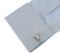 silver bull head long horn steer skull cufflinks displayed on a white dress shirt sleeve cuff close up image