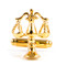gold scales of justice close up image