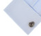 movie reel cufflinks displayed on a white dress shirt sleeve cuff close up