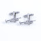 silver trumpet cufflinks shown as a pair side view close up image