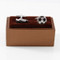 soccer cleat and soccer ball cufflinks displayed on a presentation gift box close up image