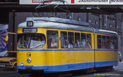 Arnold HN2603D Tram Duewag GT6, one front light, yellow/blue livery "Essen", ep. IV-V, with DCC decoder N Gauge