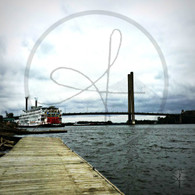 American Queen and Barge under Bridge