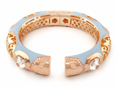 This bangle is surrounded with blue enamel Cubic Zirconias and cabochons. Hinged for easy slip on. Arrives with manufacturer's Warranty. Designed by Lauren G Adams.  Matching  Allure earrings and cocktail ring also available.