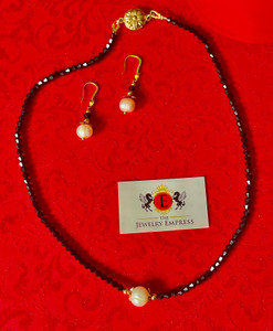 Fashion Jewelry Set of Necklace & Earrings 

Necklace:

Black Crystal Beads
Fresh Water Pearl 8mm
Gold plated zinc findings
20'' Length w/ Flower Magnetic Closure
Earrings:

Fresh Water Pearls 8mm
Black Crystal Beads with CZ Crystals
Hook Wire Tops - Pierced Only
Gold Plated 