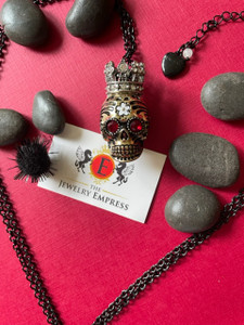 Featuring Betsey Johnson Jewelry

Skull Pendant Necklace with 18" black chain with 1.5 chain extention with branded heart charm 
Pendant Color: Gold Tone  
Red Crystal Eyes
Closure Lobster Clasp 
Crown Encased with Crystals & Embellishments
Flower Artistry 
Fashion Jewelry