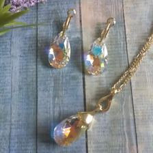Beautiful Aurora Borealis crystal stone necklace set with matching Aurora Borealis crystal earrings. Available in posts only with leverbacks for a secure and comfortable fit. Necklace is 18" in length, gold and rhodium plating with lobster clasp. Arrives beautifully packaged. Ships with tracking, Arrives 2 to 3 days.