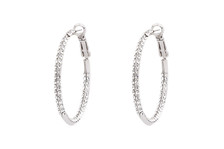 Encrusted 1-1/2" diameter Silver-tone Hoops made with Swarovski elements, Crystals inside hoop and out, lead nickel free & cadmium compliant. Also available in gold tone. Beautifully packaged with gold tissue in a gorgeous organza bag ready for giving or for the wonderful you!