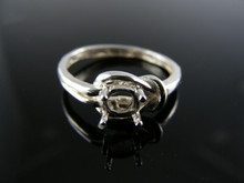 5763 LOVE KNOT RING STERLING SILVER , 4.5MM ROUND STONE SIZE 6