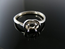 5765 LOVE KNOT RING STERLING SILVER , 5MM ROUND STONE SIZE 9