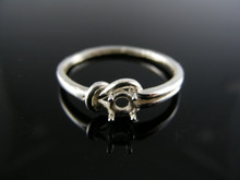 5762 LOVE KNOT RING STERLING SILVER , 4MM ROUND STONE SIZE 9