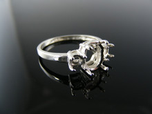 5630  RING SETTING STERLING SILVER, SIZE 7.5, 2-3MM ROUNDS 1-8X6 OVAL CENTER STONE