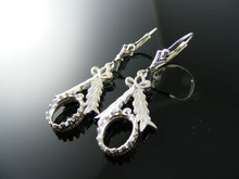 ER21  EARRING SETTING STERLING SILVER, 9X7 MM CAB. OR FACETED STONE