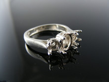 5635 RING SETTING STERLING SILVER, SIZE 7.25, 1-8X6 MM OVAL 2- 5 MM ROUND STONES