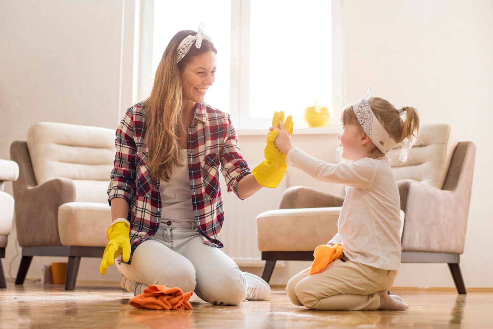 Woman and her daughter cleaning.