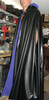 Reversible Pleather and Peachskin Cape with Working Hood, button with chain closures in front, and armholes. Model is 6'4" tall.