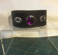 Large Purple Center Stone with 2 Square Chain Links. Velcro Closure. We make a lot of different wristbands, these are but a few
