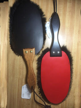 Black leather with Black Fur and Medium Wood Handle, Red leather with Black Fur, black Corian® Handle ( remember Corian® varies a lot). Fur also comes in a lot of differnt colors, sometimes getting black in a good quality can be a problem, so we accept other choices, which can also be fun.