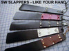 Daily Slapper in a variety of Handle and Jewel colors. They are generally made with one layer of black leather in the center, and are not sewn.