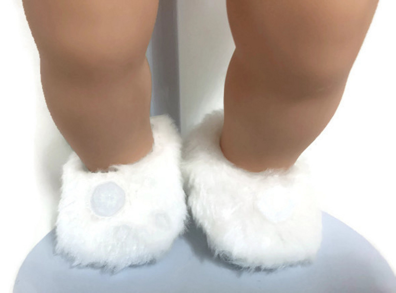 white slippers with pom poms