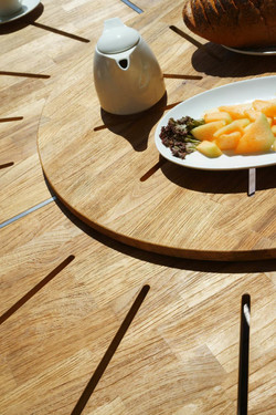MEIKA Round Dining Table's Central Rotating Insert (detail) - Stainless Steel (hairline finish), Recycled Teak (brushed finish)