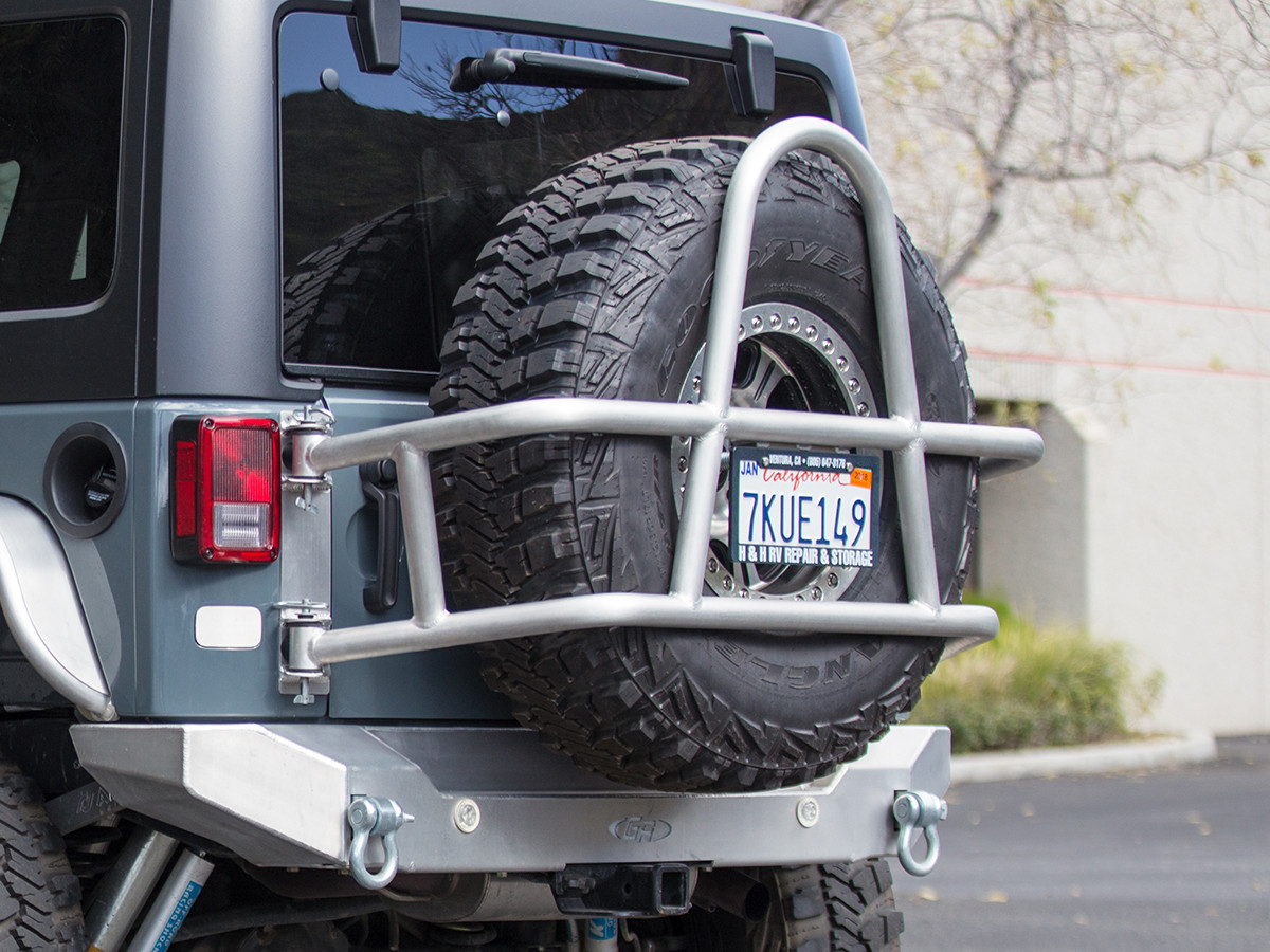 Jeep Wrangler Rear Tire Carrier | Jeep JK Swing Out Tire Mount | Aluminum Tire Carrier | White Jeep Sahara Lifted With Tire Carrier And Led Tail Lights | | GenRight Offroad