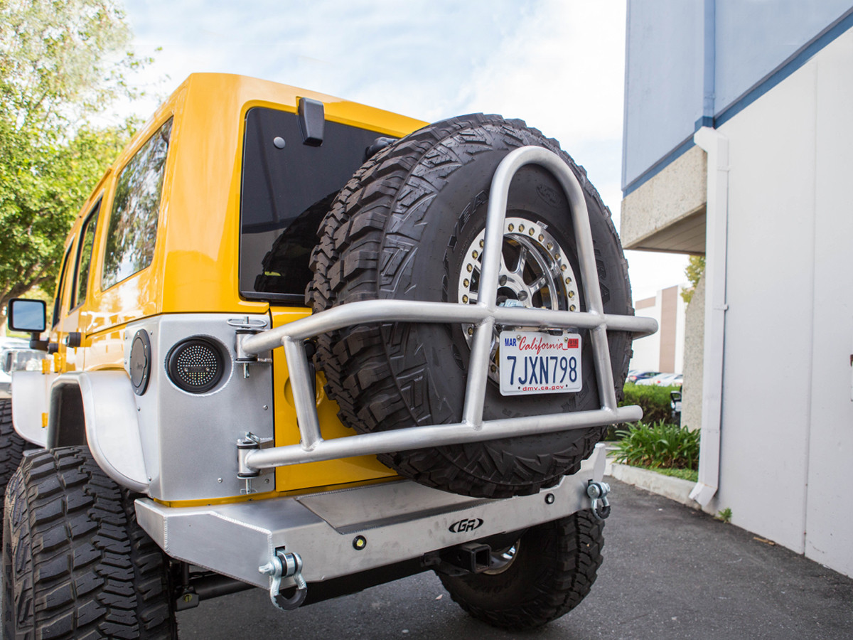 Jeep Wrangler Rear Tire Carrier | Jeep JK Swing Out Tire Mount | Aluminum Tire Carrier | White Jeep Sahara Lifted With Tire Carrier And Led Tail Lights | | GenRight Offroad