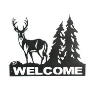 Welcome sign with buck and tree in the background