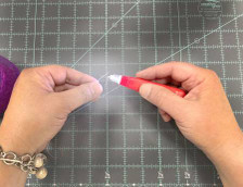 Demonstrating the Lighted Needle Threader by The Gypsy Quilter