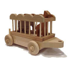 The maple and cherry circus car carries an elephant and giraffe made of cherry and walnut and is a young child's delight. This is a best seller with grandparents, who remember their own fascination with circus trains. The circus car is 12" long x 4" wide. The elephant is 4" wide and 3" high. The giraffe is 2" wide and 5" high. 