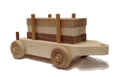 The log car comes loaded with nine six-inch logs of maple, walnut and cherry that children like to load and unload. When combined with the tender's blocks and a little imagination, the building can go on for hours. The log car is 12" long x 4" wide. 