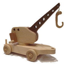 Crane car features a real working crane with a handle that turns and a wooden hook on the end. Picks up the cargo in our Flat Car as well as other small objects that children seem to have in abundance. The crane car is 12" long x 4" wide.