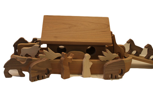 Noah's Ark is crafted of solid cherry and includes Noah and his wife, nine pairs of wooden animals (doves, elephants, giraffes, camels, bears, cows, lions, pigs, and horses) for a total of eighteen animals, and a ramp to help them climb aboard. The animals are in cherry, birch,walnut and oak. The ark is a unique keepsake gift for a new baby, or toddler's birthday. The ark is 19" long x 9" high x 8" wide.