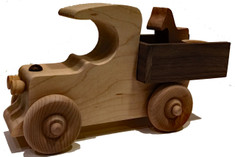 Our classic vehicle is ideal for pushing, loading and unloading. The pickup truck includes a small wooden horse and a feed bucket, but you can deliver it filled with candy or a special treat to a child. It is hand crafted of maple and walnut and has a walnut stripe down the middle and is 8" long x 4" high x 2" wide.