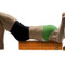 Model laying on Trigger Point GRID 2.0 Foam Roller