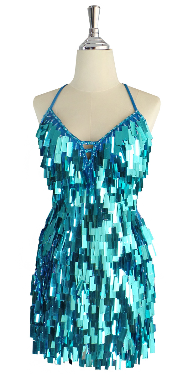 A short handmade sequin dress, in rectangular metallic turquoise color