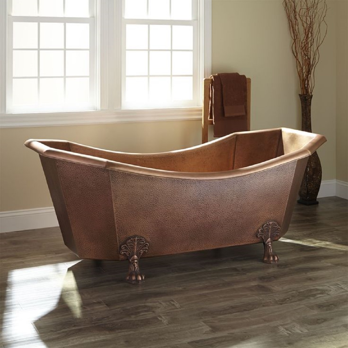 copper clawfood bathtub in a rustic bathroom