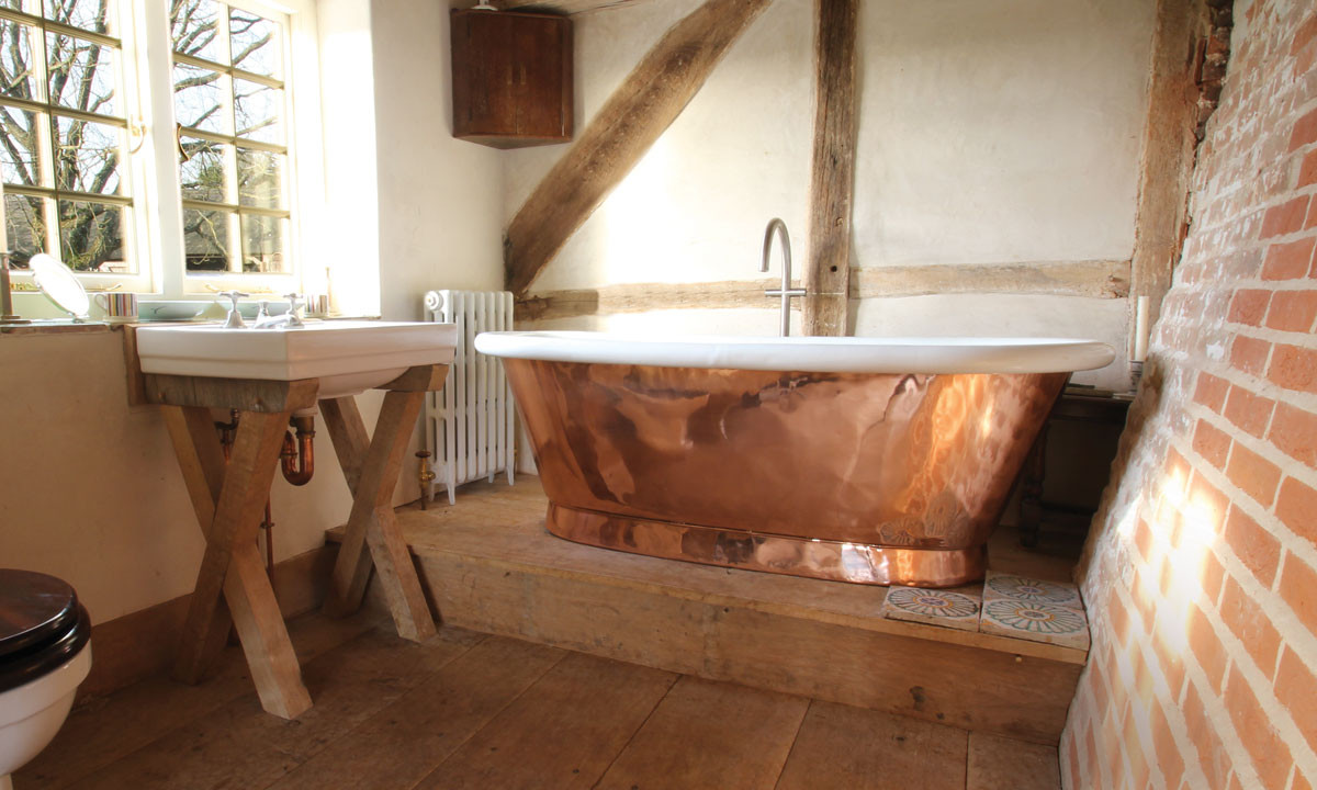 household copper tub in a bathroom