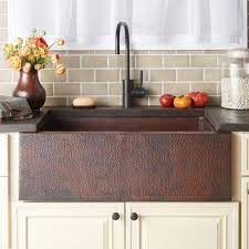 hammered copper sink in a country kitchen