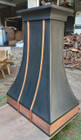 dark zinc range hood with copper apron side view
