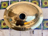 oval brass sink for a rustic bathroom