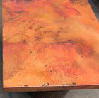 detail of a square copper table-top