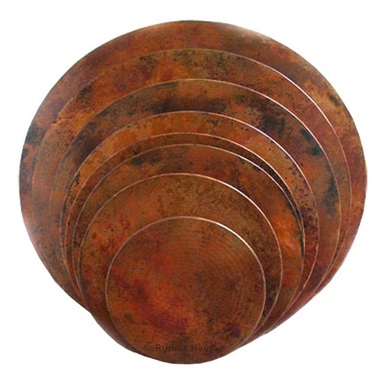 Front view of the round copper table top with a natural fired patina finish.