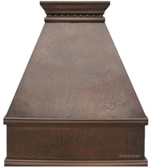 Greenville style copper range hood with a pyramid shape, trimmed apron, and tan patina finish.