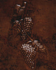 Close-up of the hand-hammered copper surface and fruit detailing.